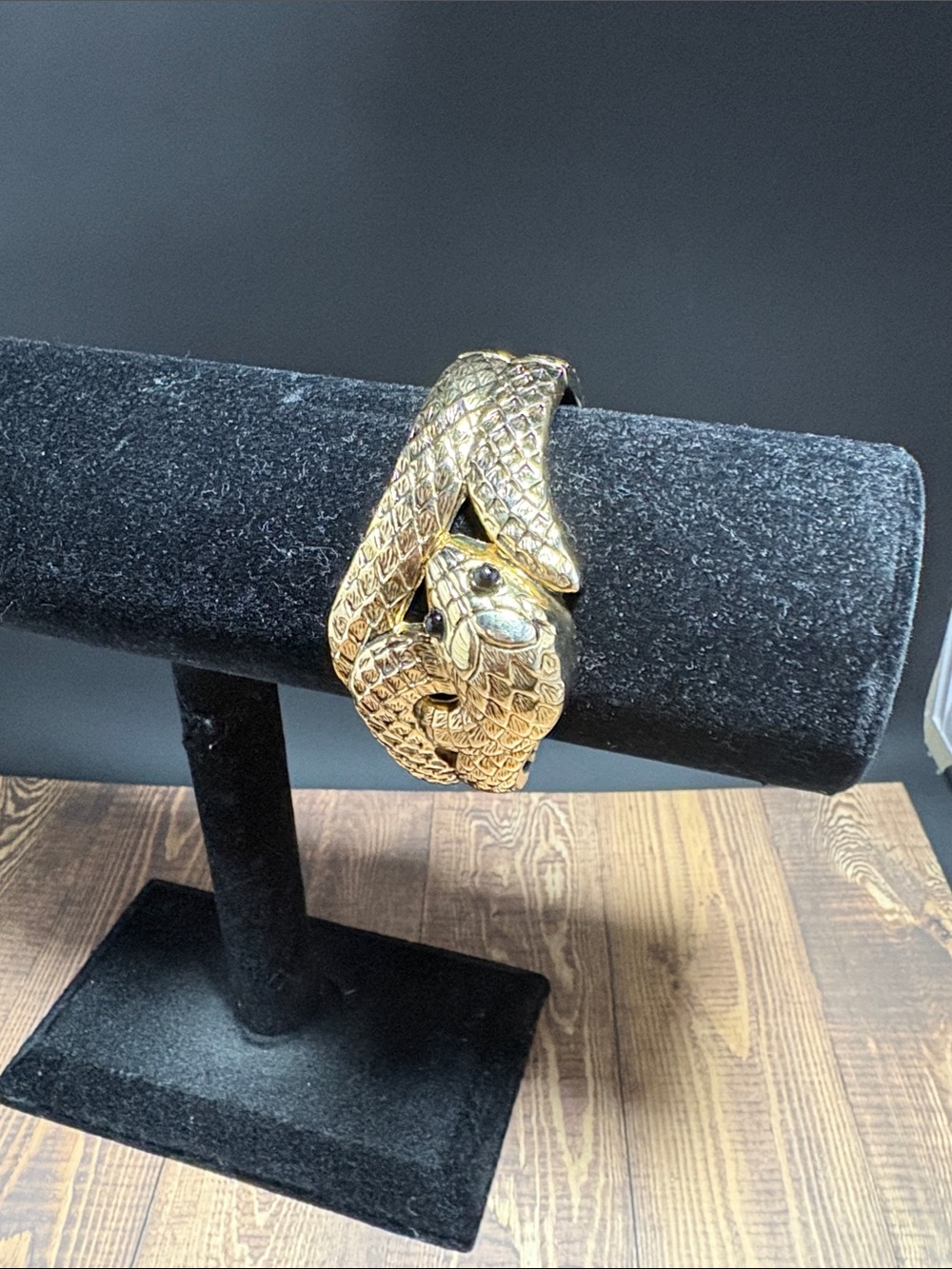 Snake bangle clamp bracelet in gold tone hardware with black details hinged